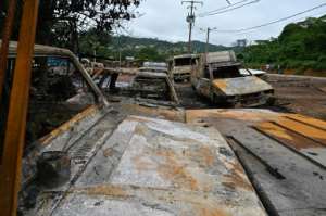 Many shops and restaurants on Bongouanou were looted and set on fire, and several cars were torched. By Issouf SANOGO (AFP)