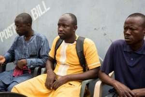 Mansuru Tahiru (c) the cousin of the late Ghanian reporter Ahmed Hussein Suale, joins friends at a January 2019 event mourning his slain relative in Accra.  By Ruth McDowall (AFP/File)