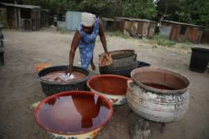 Making burukutu is a time-consuming business -- it takes three days to steep, ferment, filter, boil and refilter the brew. By Kola Sulaimon (AFP)