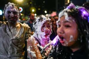 Malaysians celebrated with bubbles in Kuala Lumpur. By Mohd RASFAN (AFP)