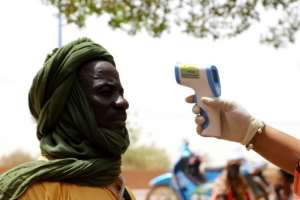 Mali has imposed a curfew and other controls to stop the spread of coronavirus as they vote goes ahead. By Souleymane Ag Anara (AFP)