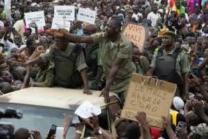 Malian demonstrators on Friday hailed soldiers for the military overthrow of President Ibrahim Boubacar Keita. By ANNIE RISEMBERG (AFP/File)