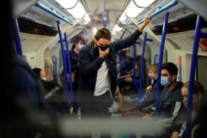 Masks and social distancing are now an everyday part of life in many cities. By Tolga Akmen (AFP)