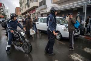 Members of Morocco's Interior Ministry Auxiliary Forces instruct a man to return home in the capital Rabat. By FADEL SENNA (AFP)