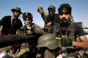 Members of Khalifa Haftar's self-proclaimed eastern Libyan National Army (LNA) special forces gather in the city of Benghazi on June 18, 2020 -- many fear Libya's elections could reignite civil war. By Abdullah DOMA (AFP/File)