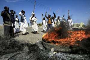Members of the Beja ethnic group of east Sudan demonstrate outside the Osman Digna port in the Red Sea city of Suakin. By ASHRAF SHAZLY (AFP/File)
