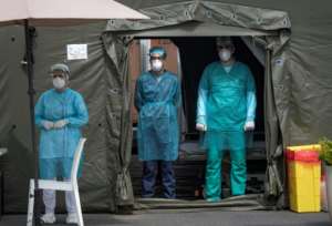 Members of the medical staff at the Mohammmed V military hospital, wear a protective masks and caps as they wait for patients, in the Moroccan capital Rabat. By FADEL SENNA (AFP)