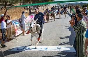 The men ran the donkeys before the beauty contest, which produced a winner for the first time in 12 years. By Fadel SENNA (AFP)