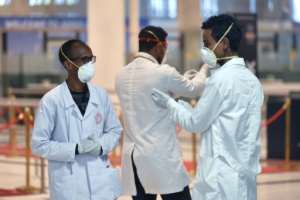 Medical staff of the Ethiopian Ministry of Health prepare to screen passengers at Bole International Airport in Addis Ababa. By Michael Tewelde (AFP)