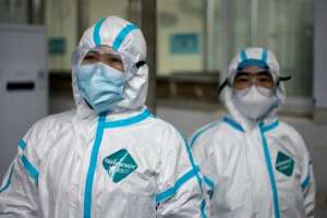 Medical workers wearing hazmat suits as prevention against the COVID-19 coronavirus at work at the Huanggang Zhongxin Hospital in Huanggang, in China's central Hubei province. By NOEL CELIS (AFP)