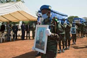 MINUSMA troops carry the coffins of four Ivorian comrades who were killed by a roadside bomb in northwestern Mali on January 13. By ANNIE RISEMBERG (AFP)