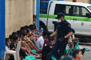 Minors were among 8,000 migrants who poured into the Spanish enclave of Ceuta this week from Morocco; most of the arrivals were sent straight back. By Antonio Sempere (AFP)