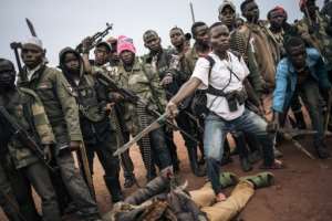 Militiamen, including children, of the Codeco armed group.  By ALEXIS HUGUET (AFP)