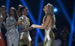 Miss South Africa Zozibini Tunzi (L) and Miss Puerto Rico Madison Anderson (R), the two finalists, wait to hear the winner's name on stage during the 2019 Miss Universe pageant at the Tyler Perry Studios in Atlanta, Georgia. By VALERIE MACON (AFP)