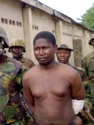 Mohammed Yusuf, 39, pictured on July 30, 2009 shortly after his capture, according to this handout picture. The circumstances of his death remain unclear -- the army said it handed him alive to the police. By HO (AFP)