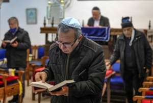 Moroccan Jews, pictured here praying at the Em Habanim synagogue in Casablanca, are a community that dates back to ancient times.  By FADEL SENNA (AFP / File)