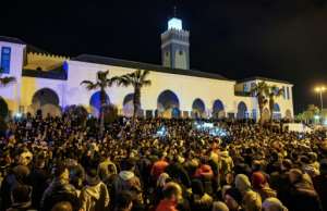 Moroccans gathered in weekly protests outside a mosque to demand support in the economic crisis.  By FADEL SENNA (AFP)