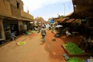 Most Khartoum businesses remain shut leaving the few shoppers who venture out dependent on the central market. By - (AFP)