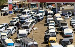 Motorists queue to fill up with petrol in Sudan where the economy is still reeling a year since the ouster of former autocratic leader Omar al-Bashir. By ASHRAF SHAZLY (AFP/File)