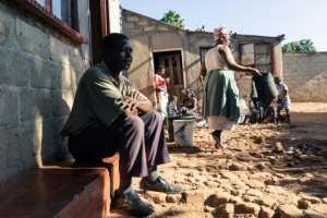 Mouths to feed: Tapiwa Chiroodza and his household in Mbare. By Jekesai NJIKIZANA (AFP)