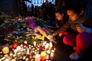 Mourners leave candles in memory of the 130 people killed in the Paris attacks in November 2015. By JOEL SAGET (AFP/File)