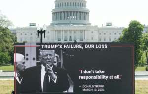 MoveOn.org stages a protest against the handling of the COVID-19 coronavirus pandemic by US President Donald Trump near the US Capitol in Washington, DC. By SAUL LOEB (AFP)