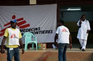 MSF's Western and Central Africa branch (team members pictured in Bangui in April 2014) said the woman, who was accompanying a patient being transported by MSF staff, was shot dead after the convoy came under