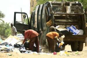 Municipality workers were out cleaning the streets of Khartoum after the strike ended. By - (AFP)