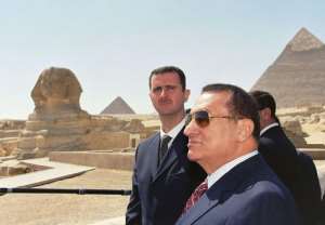 Mubarak with his Syrian counterpart Bashar al-Assad (L) at the pyramids in Giza in 2002. By - (MENA/AFP/File)