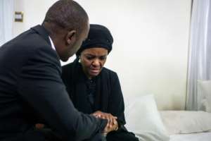 Mugabe's wife Grace arrived in Harare with the former leader's body. By ZINYANGE AUNTONY (AFP)