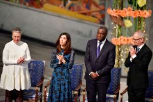 Murad applauded her joint Nobel Peace Prize laureate Mukwege at a sombre ceremony in Oslo.  By Tobias SCHWARZ (AFP)