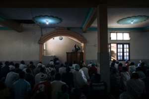 Muslim worshippers gather for Friday prayers at a mosque in Beni. By ALEXIS HUGUET (AFP/File)