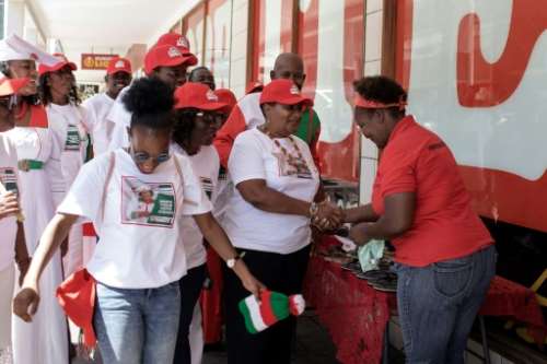 Namibia's National Unity Democratic Organisation (NUDO) presidential candidate Esther Utjiua Muinjangue (C) campaigns on the streets of Windhoek.  By GIANLUIGI GUERCIA (AFP)