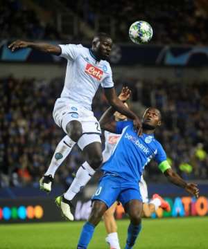 Napoli defender Kalidou Koulibaly (L) - a former Genk player - wins an aerial challenge as Samatta looks on. The sides drew 0-0 earlier this month in Belgium. By JOHN THYS (AFP/File)