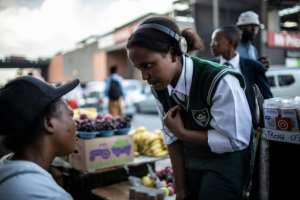 Ngobeni is conducting an interview in the suburb of Alexandra, outside of Johannesburg. By GULSHAN KHAN (AFP)