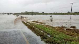 Near the small village of Mieze, floodwaters swamp the main road from Pemba. By Emidio Jozine (AFP)
