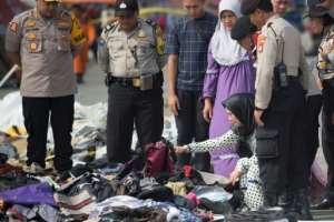 Next of kin attempt to identify personal items of loved ones who were on board the ill-fated Lion Air flight JT 610 a few days after the October 29, 2018 crash. By BAY ISMOYO (AFP/File)