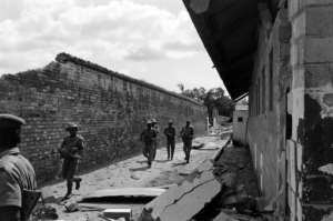 Nigerian federal army soldiers patrol near the destroyed prison of Calabar, the oldest port on the West African coast. By Colin HAYNES (AFP/File)