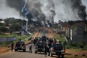 Nigerian police fire tear gas as youths protest in the capital Abuja. By Kola Sulaimon (AFP)