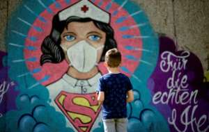 Nurses and doctors have been applauded across the globe as heroes. By Ina FASSBENDER (AFP)