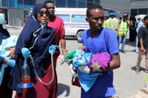 Nurses help a child wounded in the December 28, 2019 car bomb explosion in Mogadishu before being evacuated to Turkey for medical treatment. By Abdirazak Hussein FARAH (AFP/File)