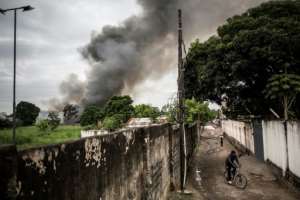 Officials said the fire at the election warehouse in Kinshasa had started simultaneously in two places, blaming it on an arson attack.  By John WESSELS (AFP)