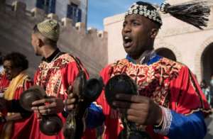 Often dressed in colourful outfits, Gnawa musicians play the guenbri, a type of lute with three strings, accompanied by steel castanets called krakebs. By FADEL SENNA (AFP)