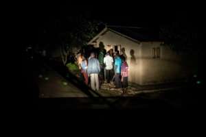 Oicha residents armed with machetes search for ADF members after their town was attacked. By JOHN WESSELS (AFP)