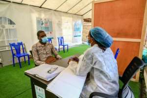 One health worker said a passer-by threatened to punch her when she offered them a vaccine dose. By Daniel Beloumou Olomo (AFP)