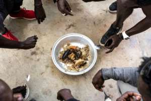 Onions are a key ingredient in Senegal's national fish and rice dish, Thieboudienne. By JOHN WESSELS (AFP/File)