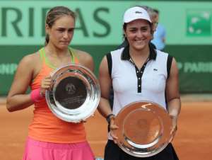 Ons Jabeur (right) beat future Olympic gold medallist Monica Puig in the junior final at Roland Garros in 2011. By JACQUES DEMARTHON (AFP)
