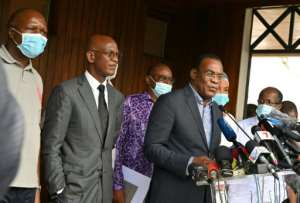 Opposition candidate Pascal Affi N'Guessan, right, announced plans for a 'transitional government' after the contested elections. By Issouf SANOGO (AFP)