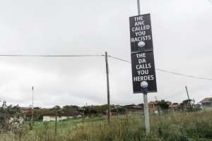 Opposition Democratic Alliance ( DA) posters hailed perpetrators of the so-called 'Phoenix massacre' as 'heroes'. By RAJESH JANTILAL (AFP/File)
