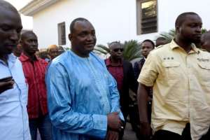 Opposition leader Adama Barrow (C) was declared the winner of the December 1 polls